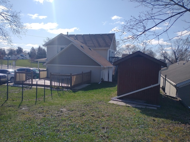 101 N Lewis St, Saline, MI 48176 - exterior space featuring a storage shed, an outbuilding, fence, a garage, and a yard