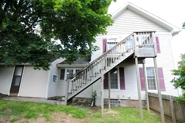 101 N Lewis St, Saline, MI 48176 - rear view of property featuring stairs and fence