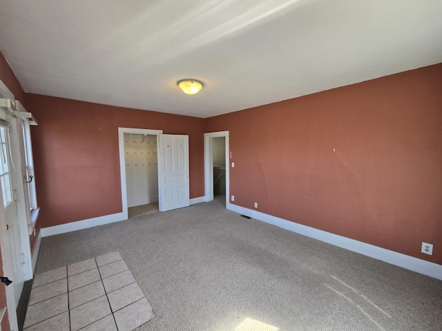 101 N Lewis St, Saline, MI 48176 - unfurnished bedroom with baseboards and light carpet