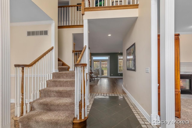 7174 Loma Linda Dr, Rockford, MI 49341 - staircase featuring tile patterned floors, baseboards, crown molding, and recessed lighting