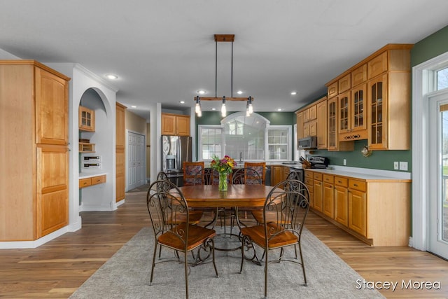 7174 Loma Linda Dr, Rockford, MI 49341 - dining room with light wood-style floors, recessed lighting, and baseboards