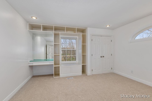 7174 Loma Linda Dr, Rockford, MI 49341 - unfurnished bedroom with carpet flooring, baseboards, recessed lighting, and a closet