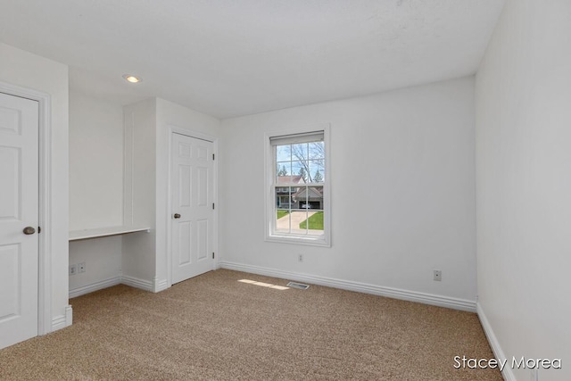 7174 Loma Linda Dr, Rockford, MI 49341 - unfurnished bedroom featuring carpet floors, baseboards, and recessed lighting