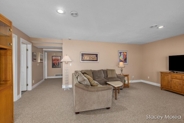 7174 Loma Linda Dr, Rockford, MI 49341 - living area featuring light carpet, baseboards, and recessed lighting