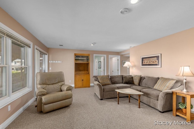 7174 Loma Linda Dr, Rockford, MI 49341 - living room featuring light colored carpet and baseboards