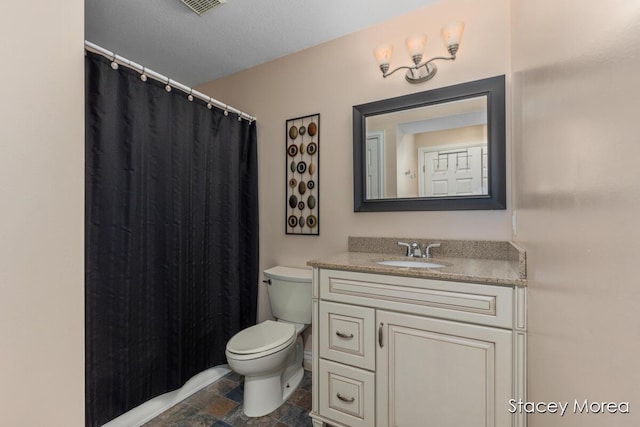 7174 Loma Linda Dr, Rockford, MI 49341 - bathroom with toilet, vanity, stone finish flooring, and a shower with shower curtain