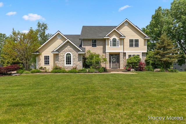 7174 Loma Linda Dr, Rockford, MI 49341 - view of front of house with stone siding and a front lawn