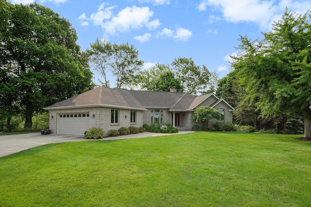 565 Hawksnest Dr, South Haven, MI 49090 - ranch-style home with driveway, an attached garage, a front lawn, and a chimney