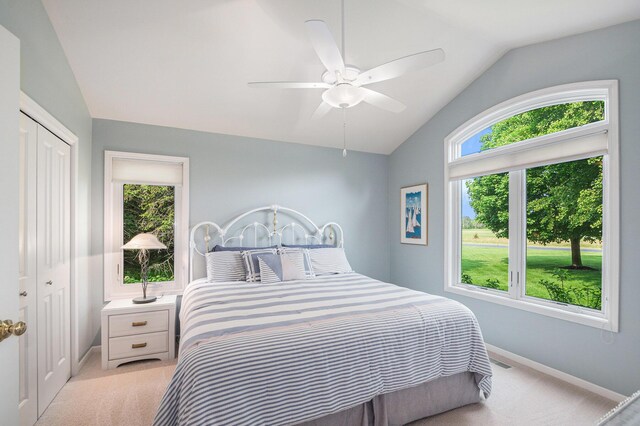 565 Hawksnest Dr, South Haven, MI 49090 - bedroom with lofted ceiling, light colored carpet, baseboards, a closet, and ceiling fan