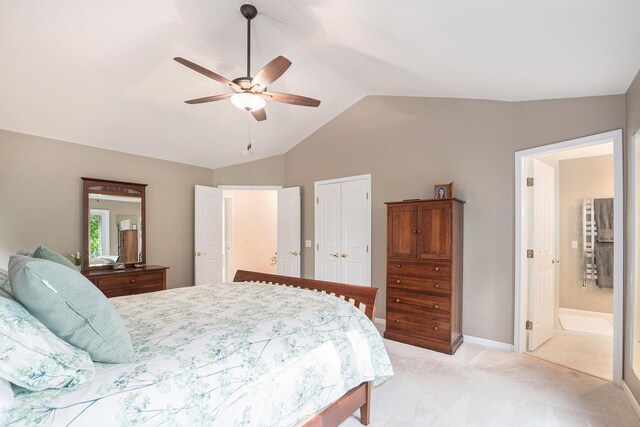 565 Hawksnest Dr, South Haven, MI 49090 - bedroom featuring light carpet, vaulted ceiling, a closet, ceiling fan, and connected bathroom