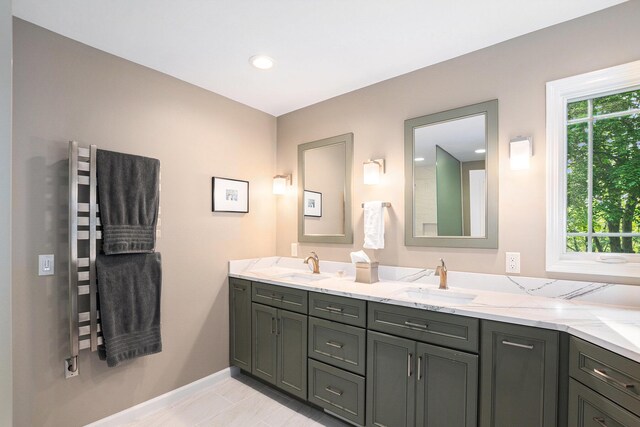 565 Hawksnest Dr, South Haven, MI 49090 - bathroom with double vanity and baseboards