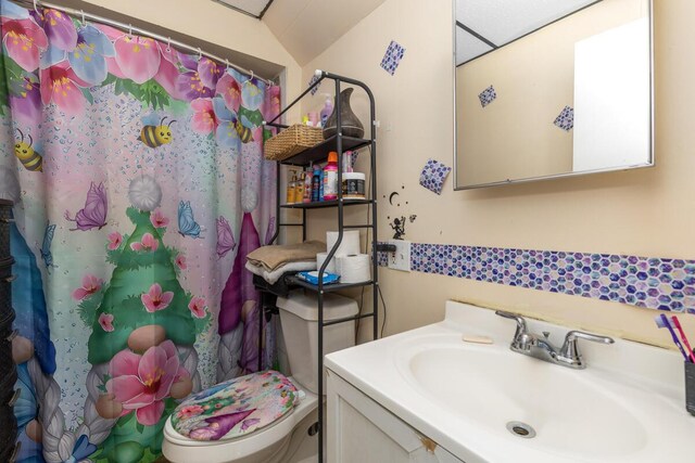 442 Emerald Ave NE, Grand Rapids, MI 49503 - bathroom featuring vanity, a shower with shower curtain, and toilet