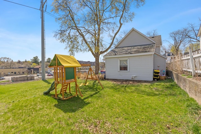442 Emerald Ave NE, Grand Rapids, MI 49503 - view of yard with a playground and fence private yard