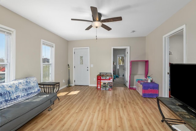 442 Emerald Ave NE, Grand Rapids, MI 49503 - living room featuring wood finished floors, a ceiling fan, and baseboards