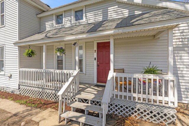 442 Emerald Ave NE, Grand Rapids, MI 49503 - property entrance featuring a porch and a shingled roof