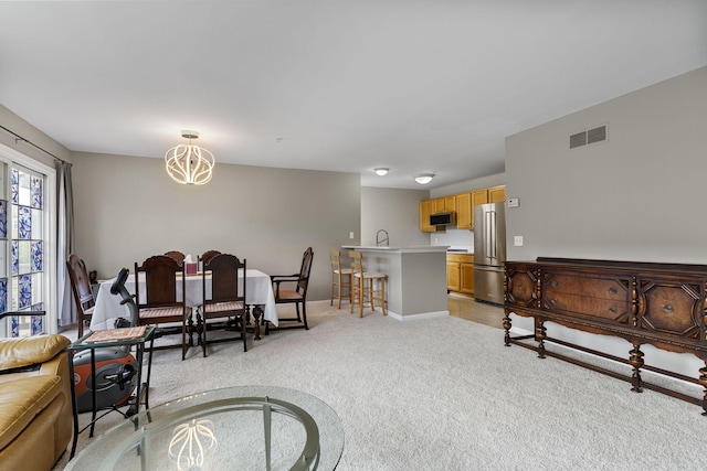2777 Barclay Way, Ann Arbor, MI 48105 - living area featuring light carpet and a chandelier