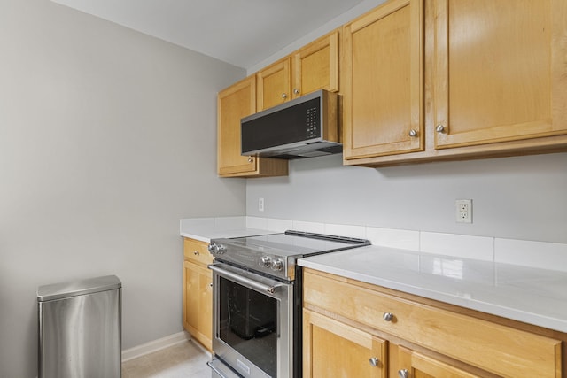 2777 Barclay Way, Ann Arbor, MI 48105 - kitchen featuring stainless steel range with electric stovetop, black microwave, light countertops, and light brown cabinets