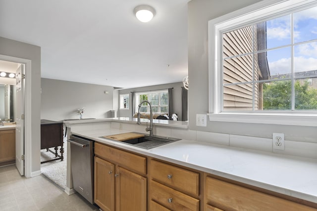 2777 Barclay Way, Ann Arbor, MI 48105 - kitchen featuring dishwasher, light countertops, and brown cabinets