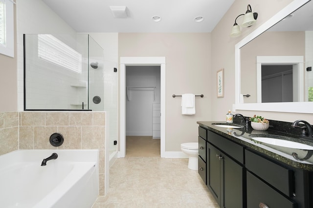 bathroom featuring a tile shower, a sink, toilet, visible vents, and a garden tub