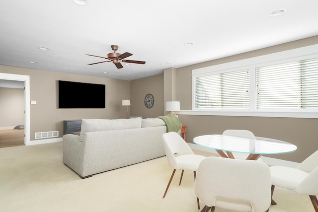 carpeted living area with recessed lighting, ceiling fan, visible vents, and baseboards