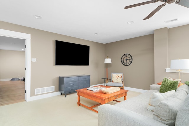 living area with baseboards, a ceiling fan, recessed lighting, and visible vents