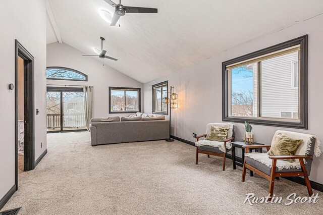 7229 Bordeau Dr NE, Belding, MI 48809 - carpeted living area featuring baseboards, visible vents, ceiling fan, and high vaulted ceiling