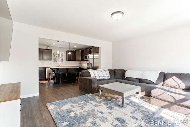 living room featuring dark wood-type flooring