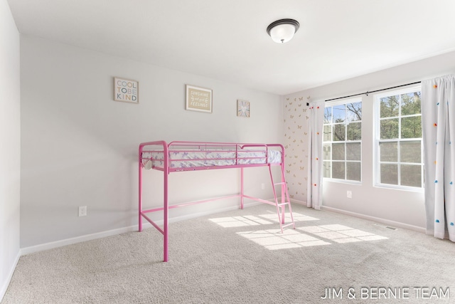 carpeted bedroom with baseboards