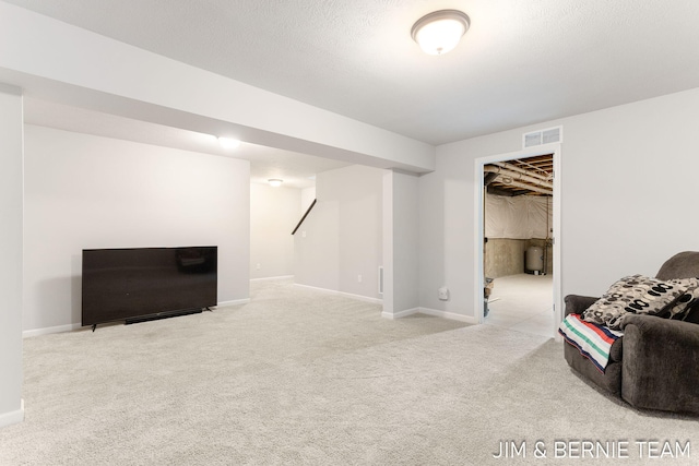 interior space featuring visible vents, carpet flooring, and baseboards