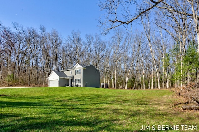 view of home's exterior featuring a yard and an attached garage