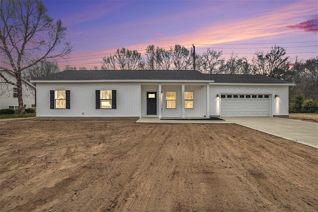 3574 Valley View Dr, Muskegon, MI 49444 - view of front of home with an attached garage, a shingled roof, driveway, and covered porch
