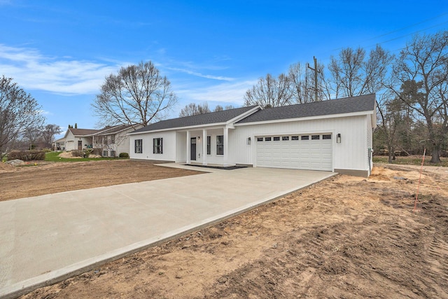 3574 Valley View Dr, Muskegon, MI 49444 - ranch-style home featuring a garage, driveway, covered porch, and roof with shingles