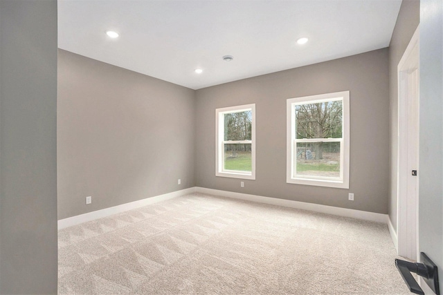 3574 Valley View Dr, Muskegon, MI 49444 - empty room featuring light colored carpet, baseboards, and recessed lighting