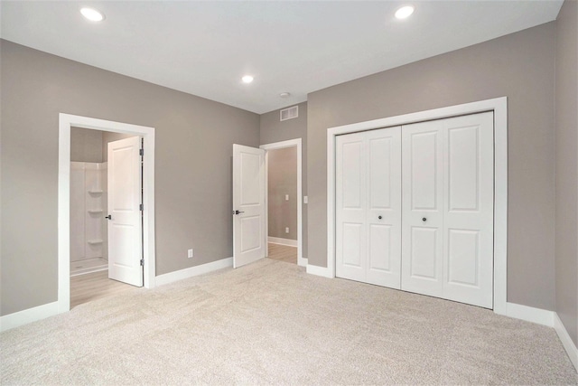 3574 Valley View Dr, Muskegon, MI 49444 - unfurnished bedroom featuring light carpet, baseboards, a closet, recessed lighting, and ensuite bathroom
