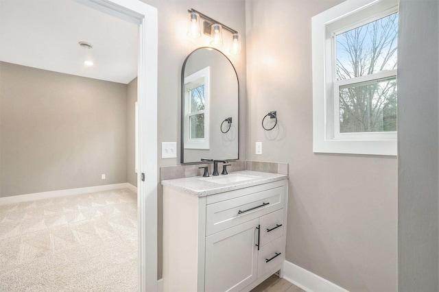 3574 Valley View Dr, Muskegon, MI 49444 - bathroom featuring baseboards and vanity