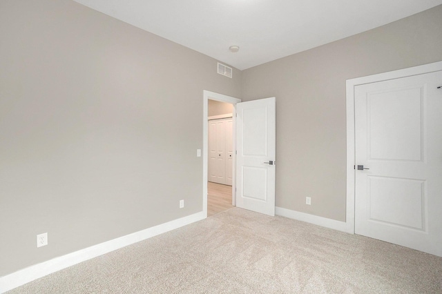 3574 Valley View Dr, Muskegon, MI 49444 - unfurnished bedroom with light colored carpet and baseboards