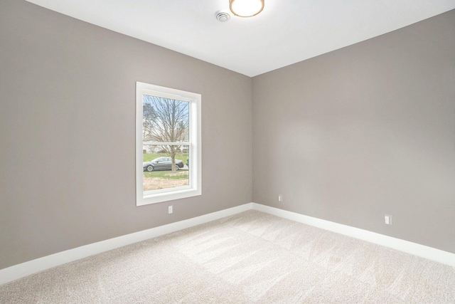 3574 Valley View Dr, Muskegon, MI 49444 - unfurnished room featuring light carpet and baseboards
