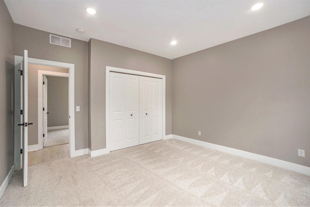 3574 Valley View Dr, Muskegon, MI 49444 - unfurnished bedroom featuring light colored carpet, baseboards, recessed lighting, and a closet