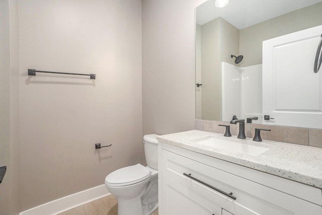 3574 Valley View Dr, Muskegon, MI 49444 - bathroom featuring toilet, a shower, vanity, baseboards, and wood finished floors