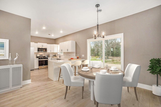 3574 Valley View Dr, Muskegon, MI 49444 - dining room with light wood-style flooring, a chandelier, baseboards, and recessed lighting