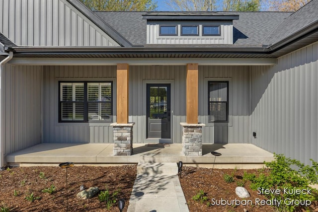 1525 Browning Dr, Grand Rapids, MI 49534 - view of exterior entry featuring a porch and a shingled roof