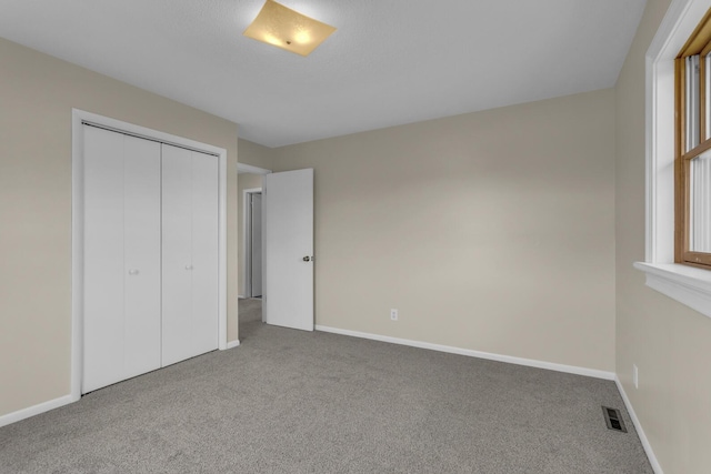 9315 Kingsley Dr, Onsted, MI 49265 - unfurnished bedroom with carpet floors, baseboards, and a closet