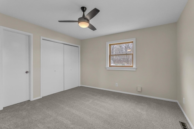 9315 Kingsley Dr, Onsted, MI 49265 - unfurnished bedroom with carpet, a closet, a ceiling fan, and baseboards