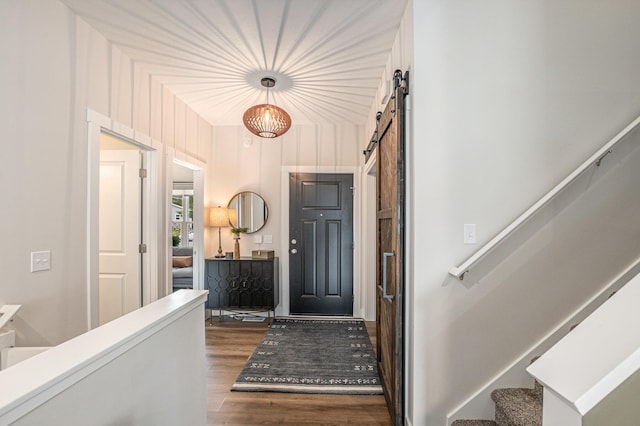 2537 Odawa Trl, Muskegon, MI 49444 - foyer entrance with dark wood finished floors, stairway, and a barn door