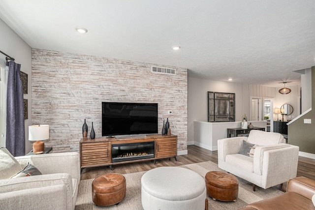 2537 Odawa Trl, Muskegon, MI 49444 - living area featuring recessed lighting, wood finished floors, visible vents, baseboards, and a large fireplace