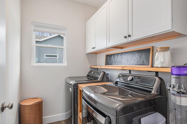 2537 Odawa Trl, Muskegon, MI 49444 - laundry room with washer and dryer, baseboards, cabinet space, and wood finished floors