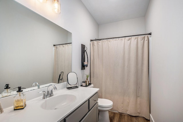 2537 Odawa Trl, Muskegon, MI 49444 - full bathroom with toilet, a shower with curtain, vanity, and wood finished floors
