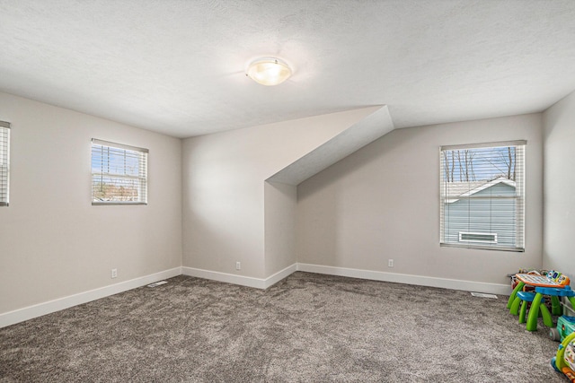2537 Odawa Trl, Muskegon, MI 49444 - additional living space with baseboards, carpet floors, and a wealth of natural light