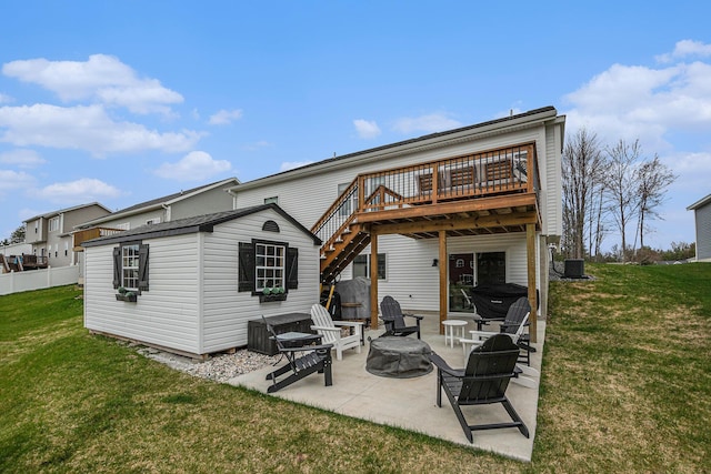 2537 Odawa Trl, Muskegon, MI 49444 - rear view of house with central AC, a wooden deck, a lawn, an outdoor structure, and a patio