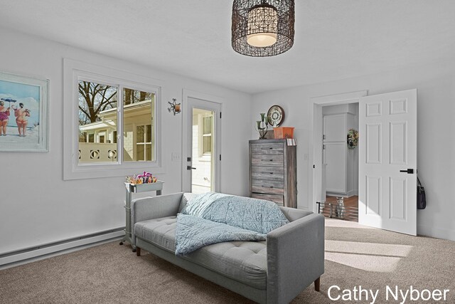 2233 Mills Ave, Muskegon, MI 49445 - sitting room featuring carpet floors, baseboards, and a baseboard heating unit